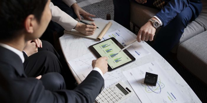 business-people-working-with-ipad-high-angle