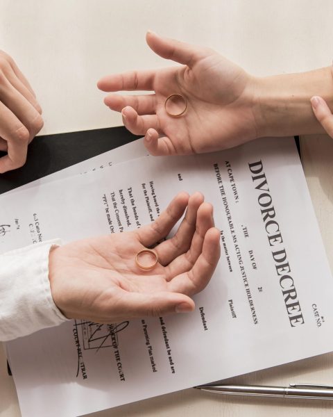 hands-with-divorce-decree-close-up
